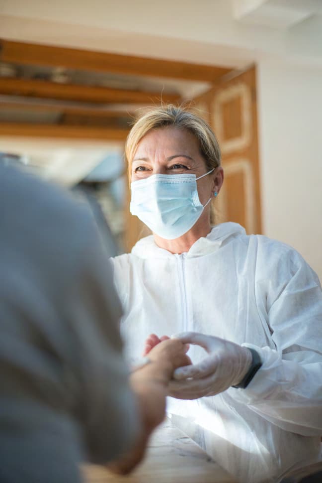 Healthcare worker in PPE in a care setting